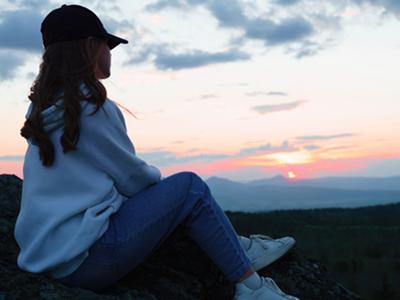 Woman overlooking horizon contemplating what to do after sexual assault